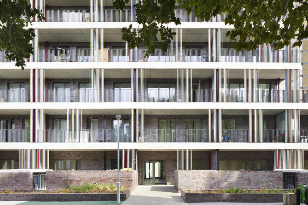 a view of the rear of the building adnd the balconies for the individual apartments looking at the shared garden